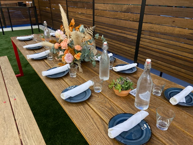 Outdoor, set table with flower arrangement